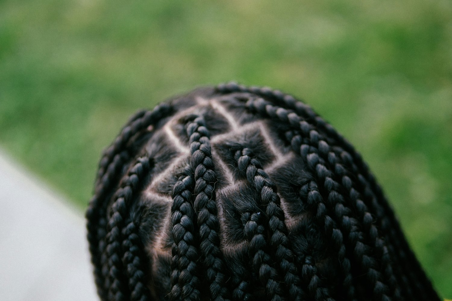 Back of a head with neat braids